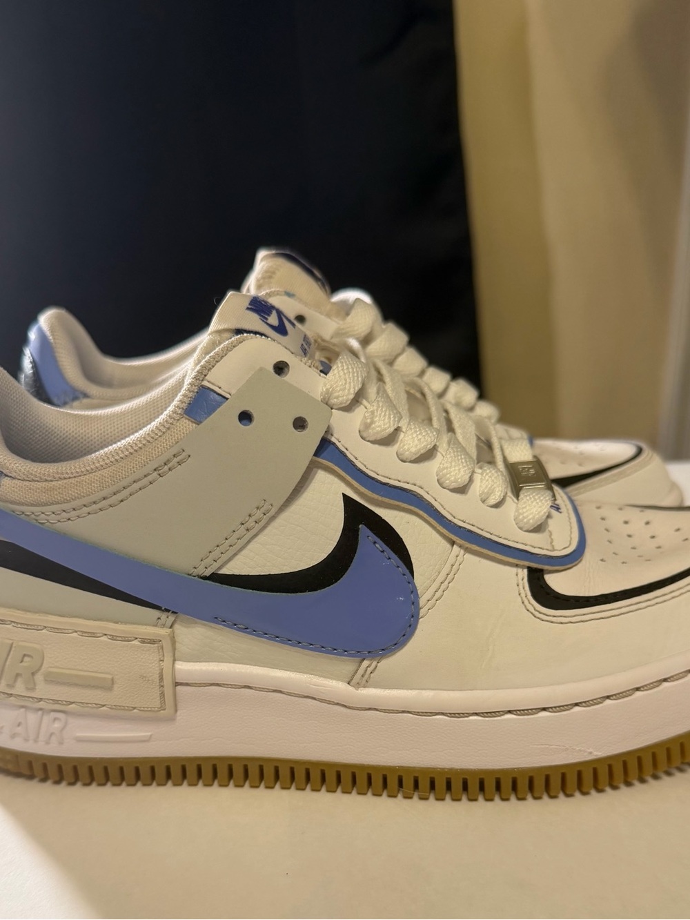 Nike Kids White and Periwinkle Low-Top Sneakers with Black Swoosh